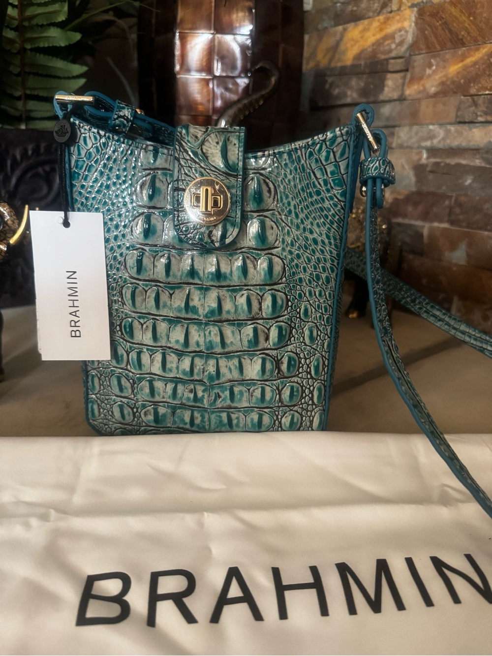 Brahmin Teal Croc-Embossed Leather Crossbody bag with Gold Hardware.